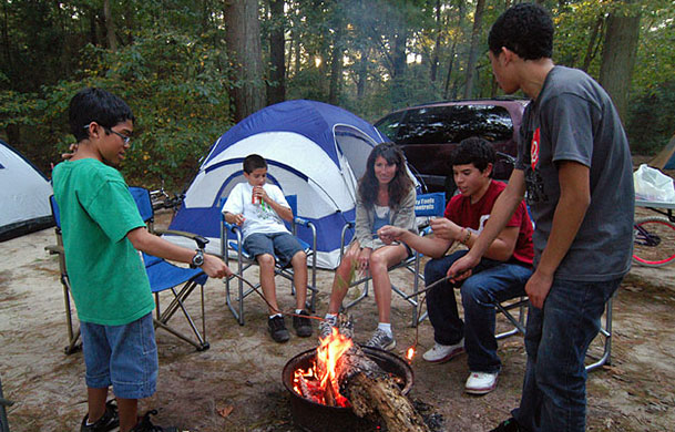Primitive tent site surrounded by trees at Beaver Trails