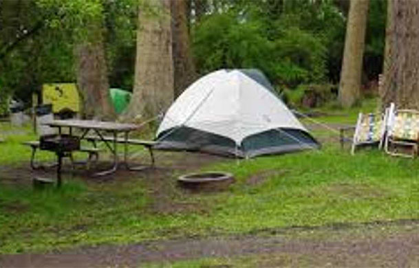 Waterfront primitive tent campsite at Adventure Bound Kamp Modoc